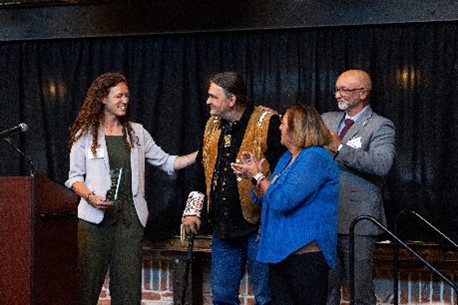 Friends of DHA Executive Director, Annie Hancock and Friends of DHA chairman and DHA CEO, Joaquin Cintron Vega recognizing achievements of a resident.
