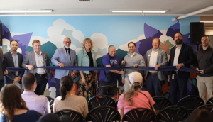 Image of the ribbon cutting at Columbine Towers' Grand Reopening